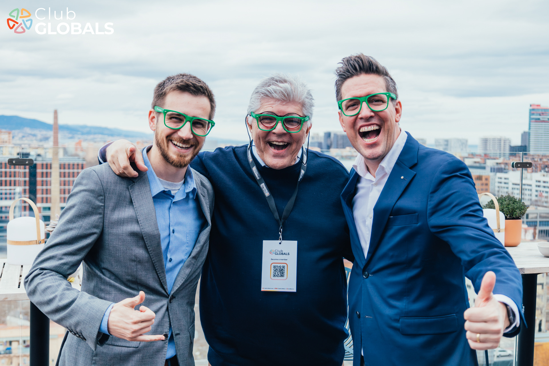 GSTF24 Three men smiling and wearing green glasses
